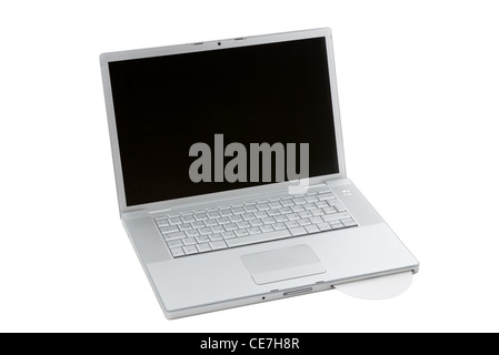 Silver portable computer with CD inserted. 3/4 view. Stock Photo