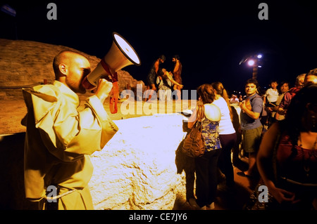 Guide with loudhailer and tourists at Tierra Santa (Holy Land theme park) at night, Buenos Aires, Argentina. No MR or PR Stock Photo