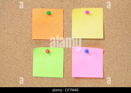 Adhesive Note Papers on Cork Board Stock Photo