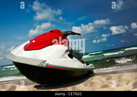 Jet-ski lies on the shore Stock Photo