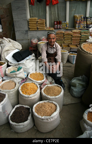 Traditional man selling spices in a market in Samarkand in Uzbekistan Stock Photo