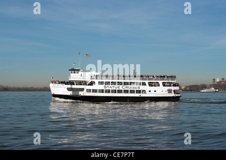 Statue Cruises on Hudson River heading toward Statue of Liberty, New York, USA Stock Photo