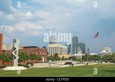 The skyline of downtown Indianapolis, Indiana and American flag Stock Photo