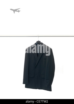 Garments hanging on coat hanger isolated against a white background Stock Photo