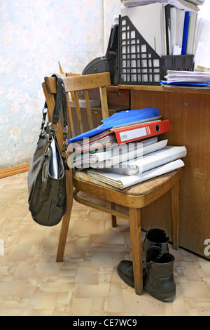 files on chair in office Stock Photo
