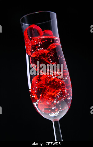 Red jelly hearts in champagne flute. Stock Photo