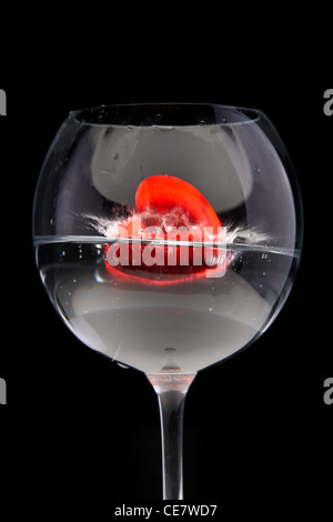 Red jelly hearts in wine glass. Stock Photo