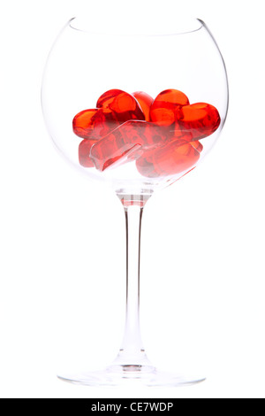 Red jelly hearts in wine glass. Stock Photo