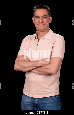 Attractive Middle Aged Man Casually Dressed Standing with Arms Folded Stock Photo