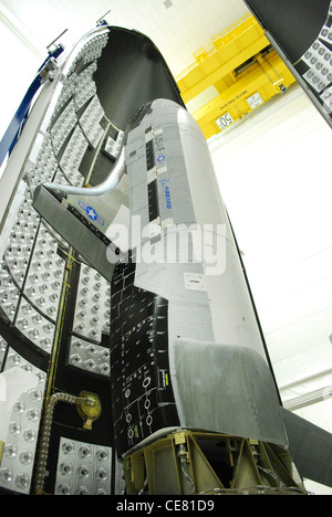 The US Air Force X-37B Orbital Test Vehicle during encapsulation within the United Launch Alliance Atlas V 5-meter fairing Feb. 8, 2011, at Astrotech in Titusville, Fla. The fairing protects and carries the OTV into space. Stock Photo