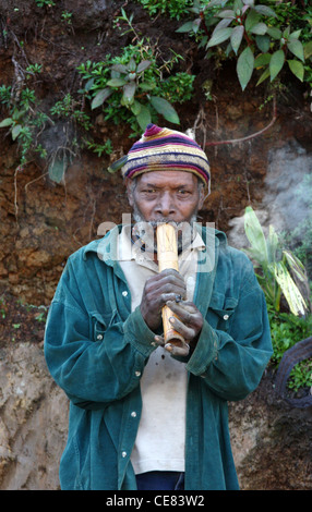 Bamboo Pipe Smoker in Papua New Guinea Stock Photo