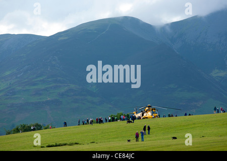 An RAF rescue helicopter in a field in Keswick Cumbria. It had landed after a mechanical problem in a public field Lake District Stock Photo