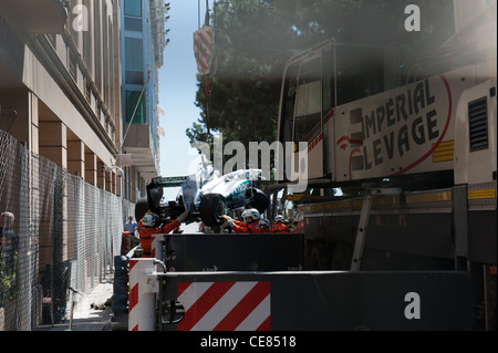 Mercedes driver Nico Rosberg car being recovered during 2011 Monaco Grand Prix Qualifying Stock Photo