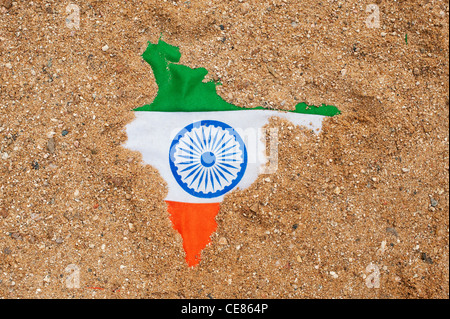 Indian flag showing through sand shaped like the map of India Stock Photo