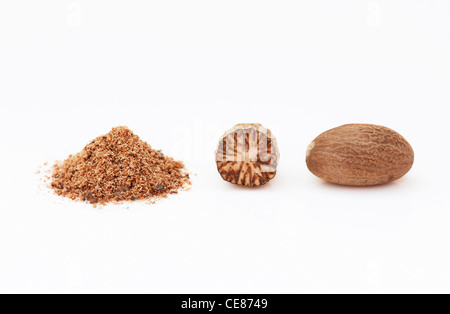 Myristica fragrans. Nutmeg and ground nutmeg on white background Stock Photo