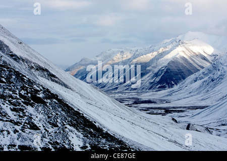 Scenic snowy winter mountainous landscape from Atigun Pass, Brooks Range, North Slope, Alaska in October Stock Photo