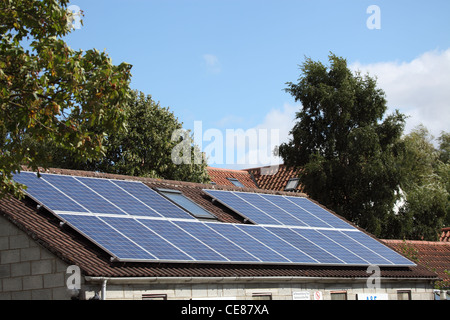 domestic 4KW solar panel array mounted on a stable roof Stock Photo