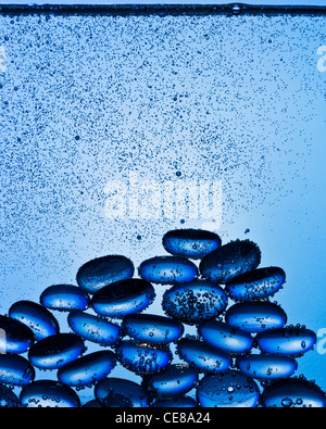 Blue glass pebbles underwater shot with professional medium format digital leaf back. Stock Photo