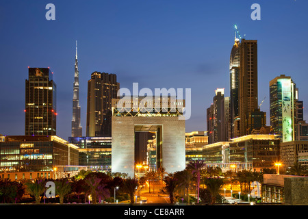 Asia, Arabia, Dubai Emirate, Dubai, Gate Building and Financial District at Dusk Stock Photo