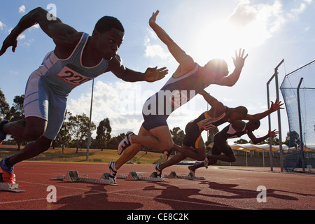 Runners Taking Off From Starting Point Stock Photo