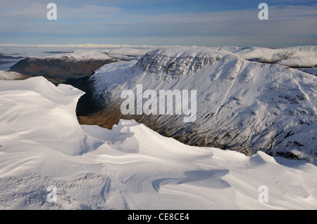 Sculpted cornices on Dollywaggon Pike looking over Grisedale Valley towards St Sunday Crag. Winter in the Lake District Stock Photo