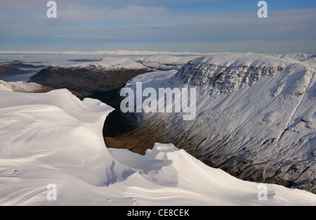 Sculpted cornices on Dollywaggon Pike looking over Grisedale Valley towards St Sunday Crag. Winter in the Lake District Stock Photo