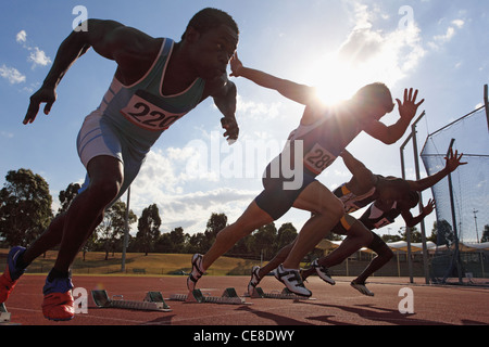 Runners Taking Off From Starting Point Stock Photo