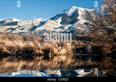 Winter reflection of Emigrant Peak in the Paradise Valley of Montana. Stock Photo