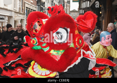 Chinese New Year of the dragon parade in the city street. Chester, Cheshire, England, UK, Britain. Stock Photo