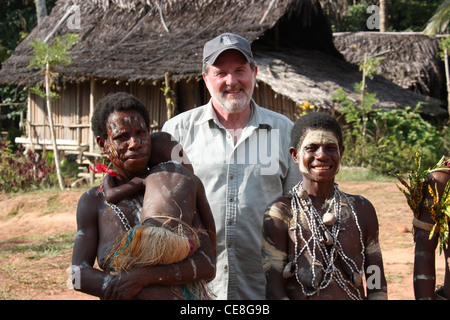 British Traveller visiting a remote village on the Karawari River in  Papua New Guinea Stock Photo