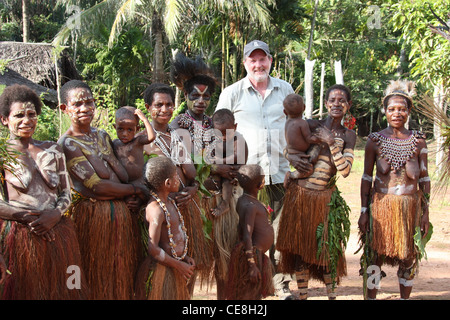 British Traveller visiting a remote village on the Karawari River in  Papua New Guinea Stock Photo