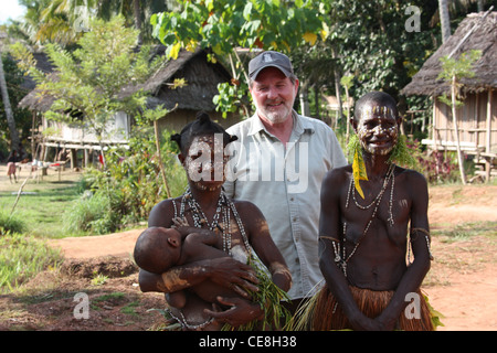 British Traveller visiting a remote village on the Karawari River in  Papua New Guinea Stock Photo