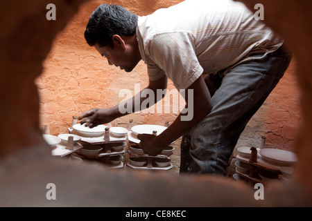 traditional Jaipur pottery making, at a pottery factory in Sanganer village, outside Jaipur, in Rajasthan, India Stock Photo