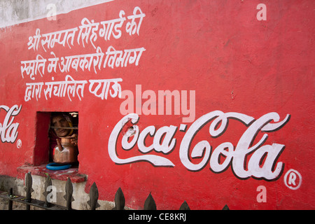 Coca-Cola sign painted on wall of shop selling water, in Jaipur, in Rajasthan, India. Stock Photo