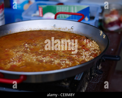 paella dish cooking with calasparra rice Stock Photo