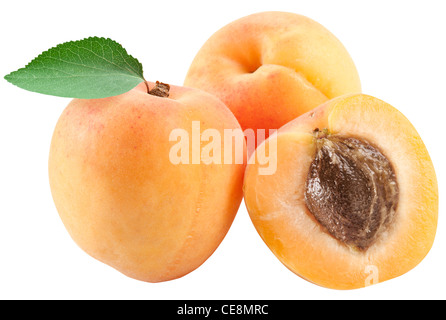 Ripe apricots with leaves on white background. File contains the path to cut. Stock Photo