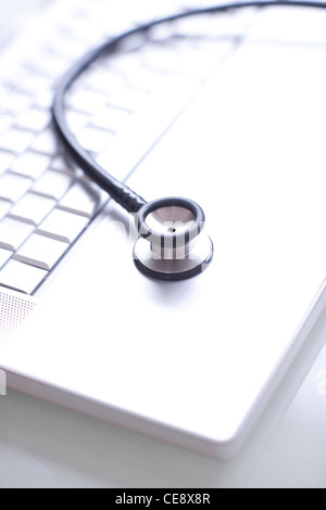Close up of computer keyboard and stethoscope, studio shot Stock Photo ...