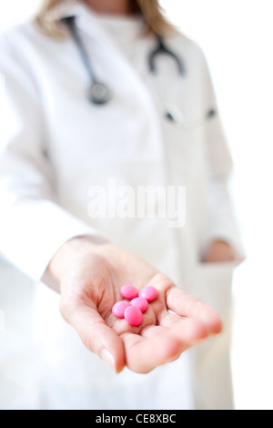MODEL RELEASED. Pills in a doctor's hand. Stock Photo