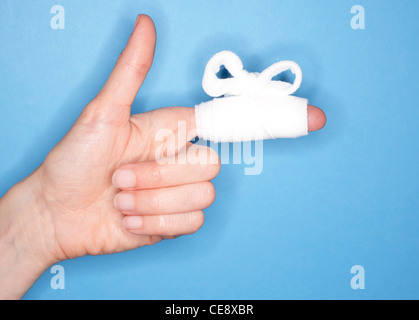 MODEL RELEASED. Bandaged finger. Stock Photo