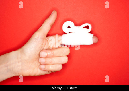 MODEL RELEASED. Bandaged finger. Stock Photo