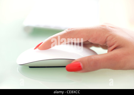 MODEL RELEASED. Woman using a mouse. Stock Photo