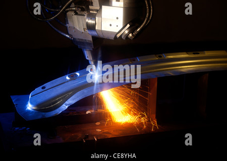 A laser cutting a metal sheet in a factory in Coventry, United Kingdom. Stock Photo