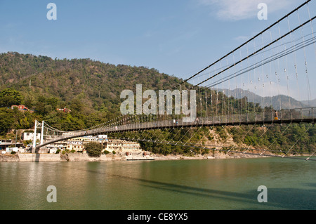Ram Jhula bridge over the Ganges river, Rishikesh, Uttarakhand, India Stock Photo