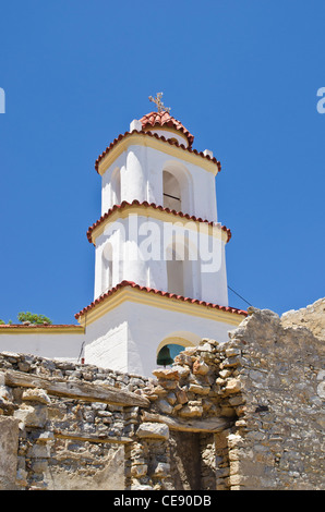 Church bell tower in the abandoned hill town of Mikro Chorio on Tilos Island, Greece Stock Photo