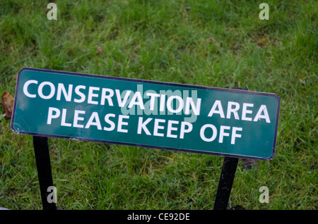 A conservation area - Keep Off metal sign on a lawn Stock Photo