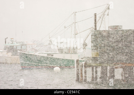 Lobster boats in snowstorm Bass Harbor Maine Stock Photo