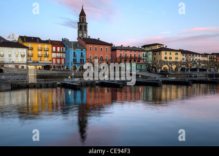 Lakefront in Ascona, Ticino, Switzerland in the evening during the sunset with reflections in the Lake Maggiore. Stock Photo