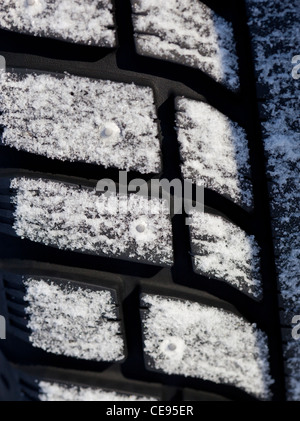 Isolated closeup of a Studded car winter tire surface , Finland Stock Photo