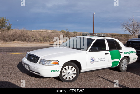 Border Patrol car on highway in Texas with U.S Customs and Border Protection logo on door Stock Photo