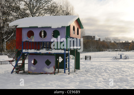 Snow covers a climbing frame in winter Stock Photo